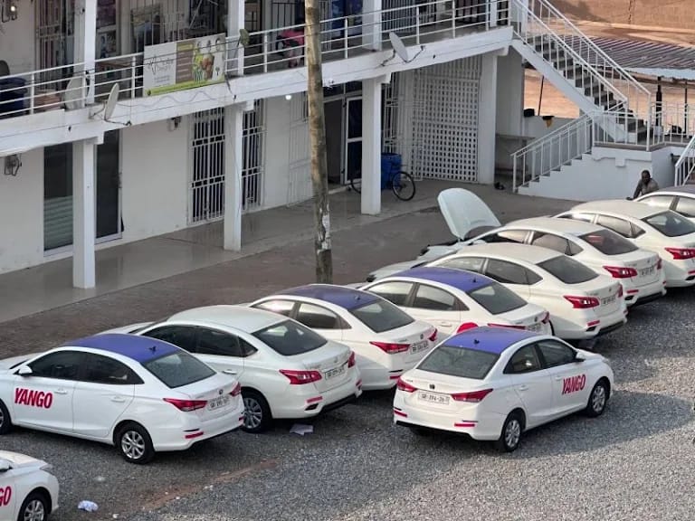 Yango-branded Axtro fleet sedans parked at the depot yard