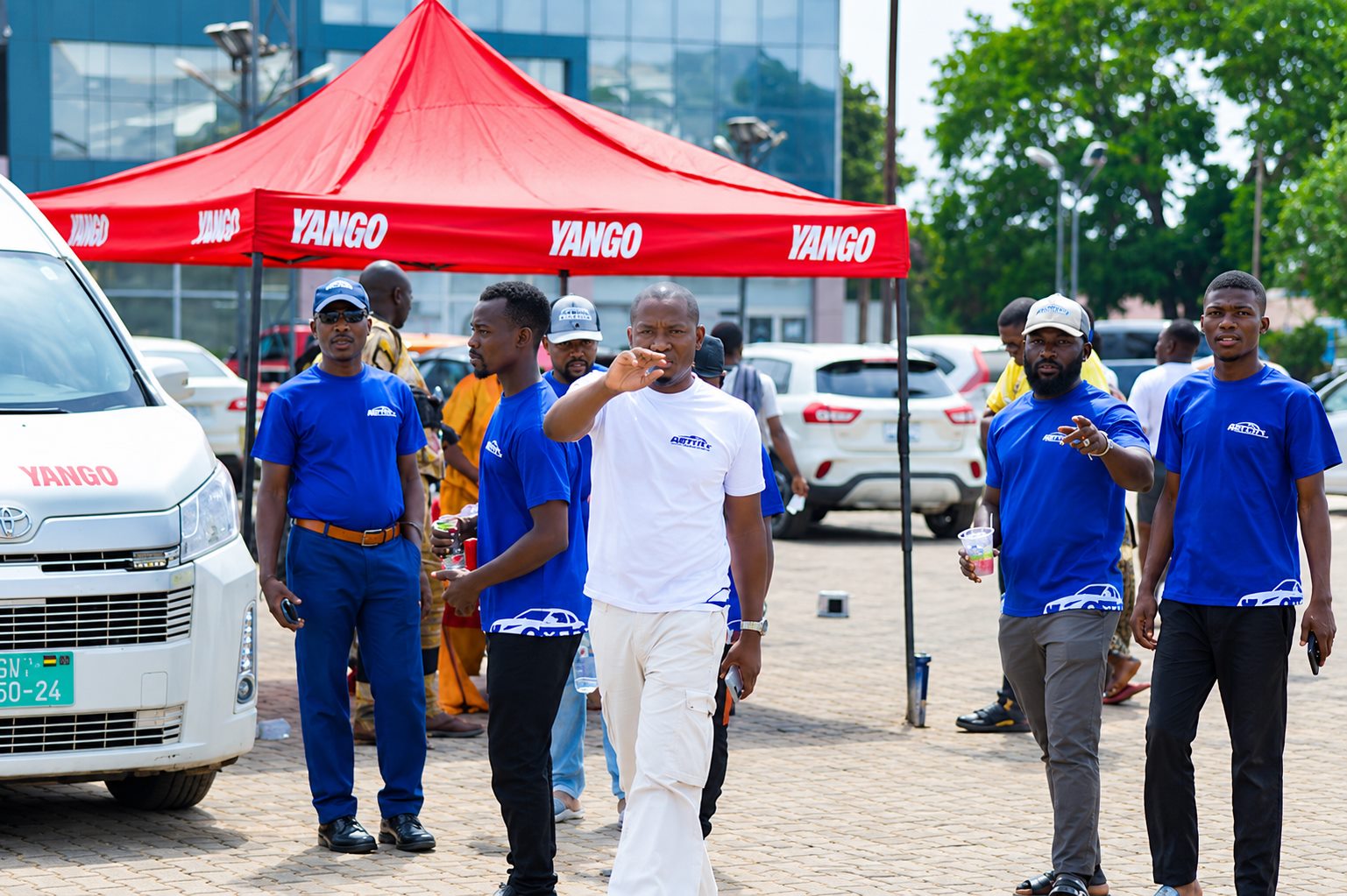Axtro field team coordinating operations at a Yango partner event
