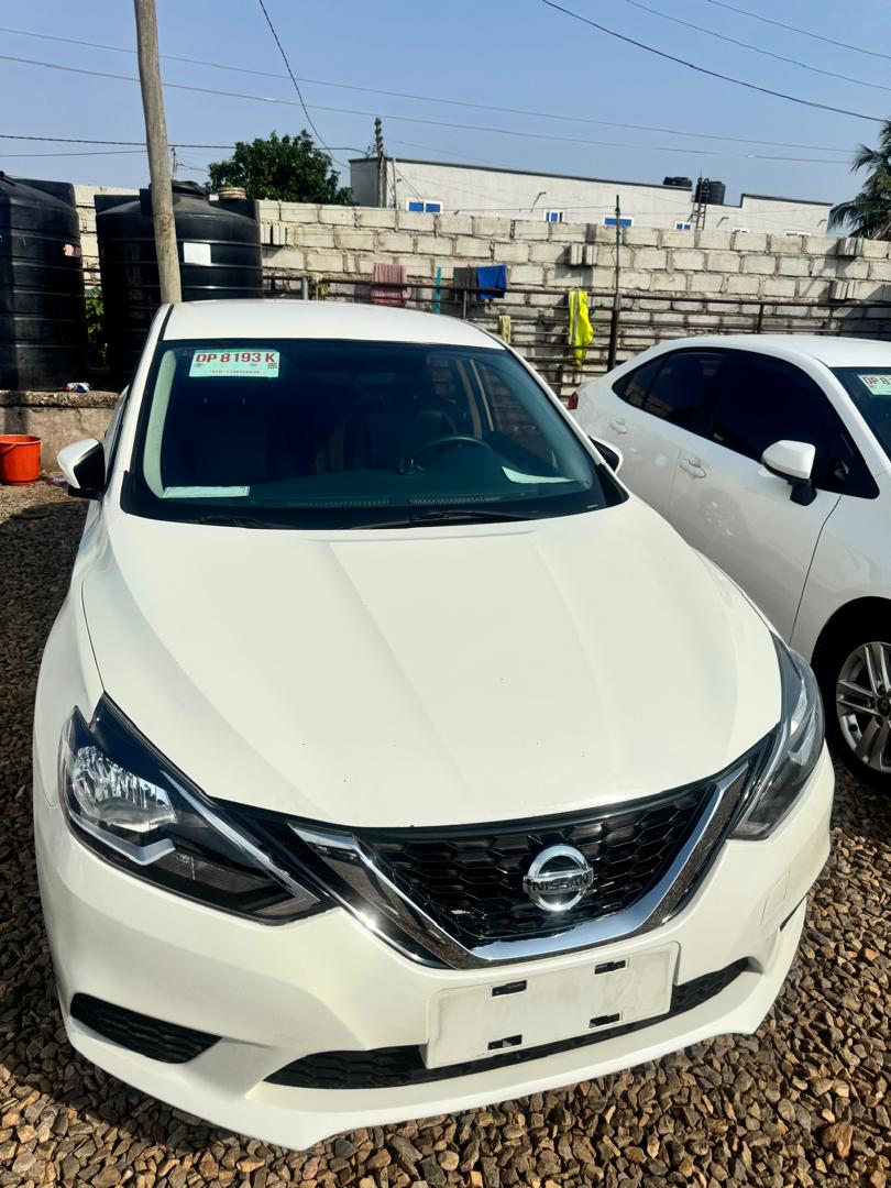 Commercial sedan side quarter view showing ground clearance