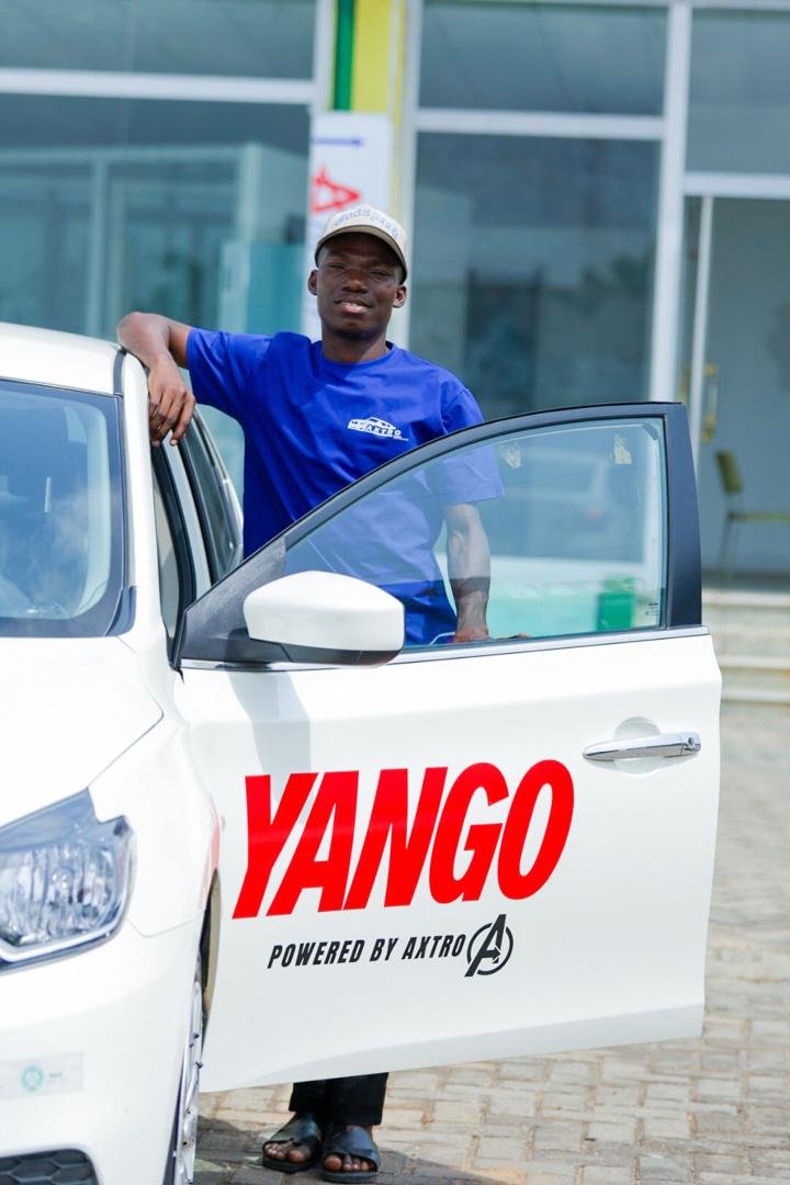 Axtro driver partner leaning beside an open electric car door